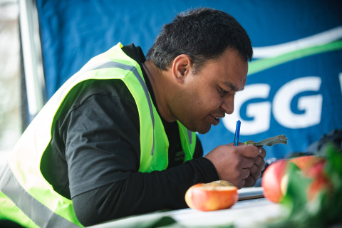 Photo of contestant assessing fruit quality
